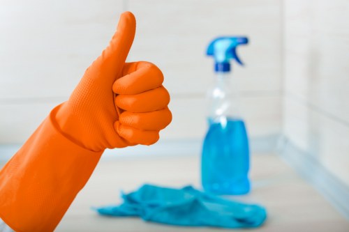Baking soda being sprinkled on a mattress for odor removal